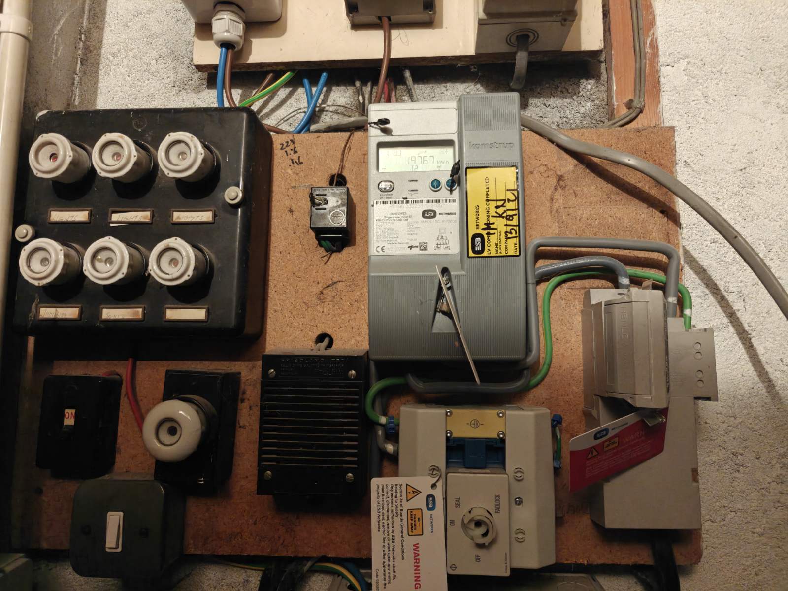 Old fuse board in Irish home requiring upgrade before EV charger installation